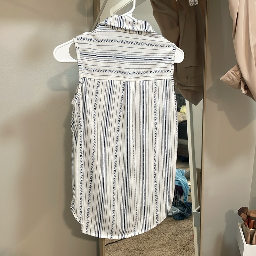 Blue and white button down tank top.